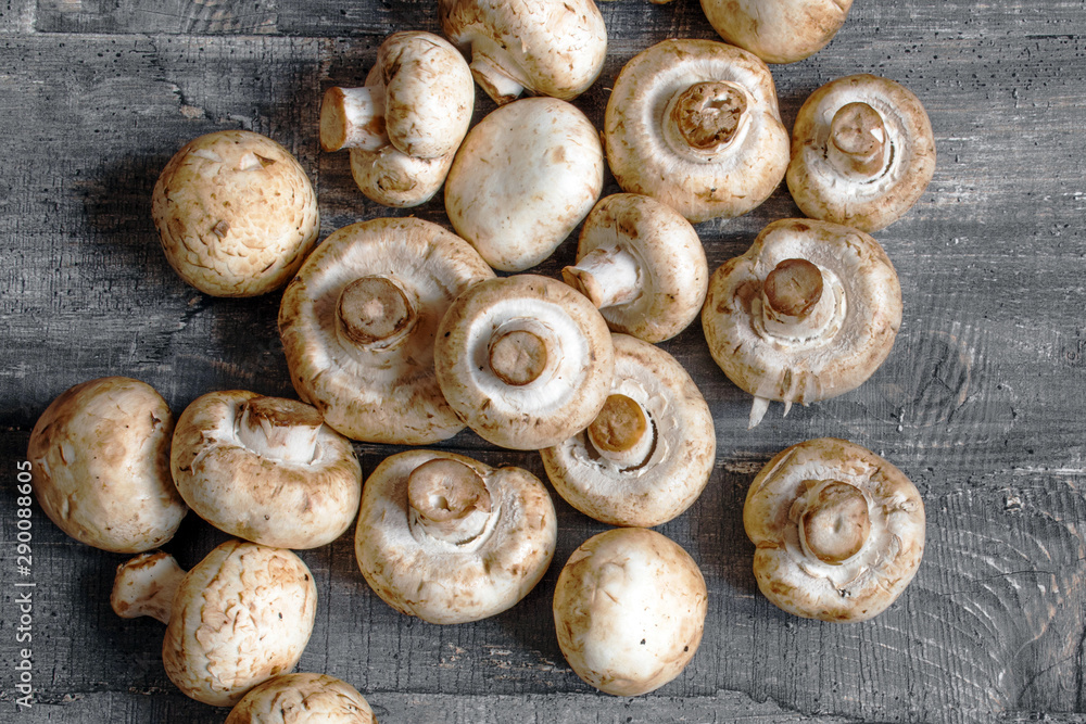mushrooms champignon on dark wood desk mushrooms champignon on dark wood desk