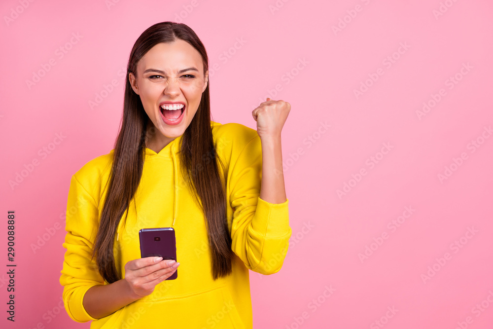 Copyspace photo of beautiful cute attractive sweet gorgeous cheerful white girlfriend holding telephone rejoicing with being liked wearing yellow sweater isolated over pink pastel color background Copyspace photo of beautiful cute attractive sweet gorgeous cheerful white girlfriend holding telephone rejoicing with being liked wearing yellow sweater isolated over pink pastel color background