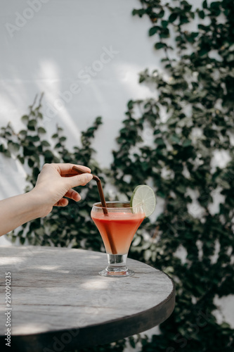 hand with a glass of cocktail