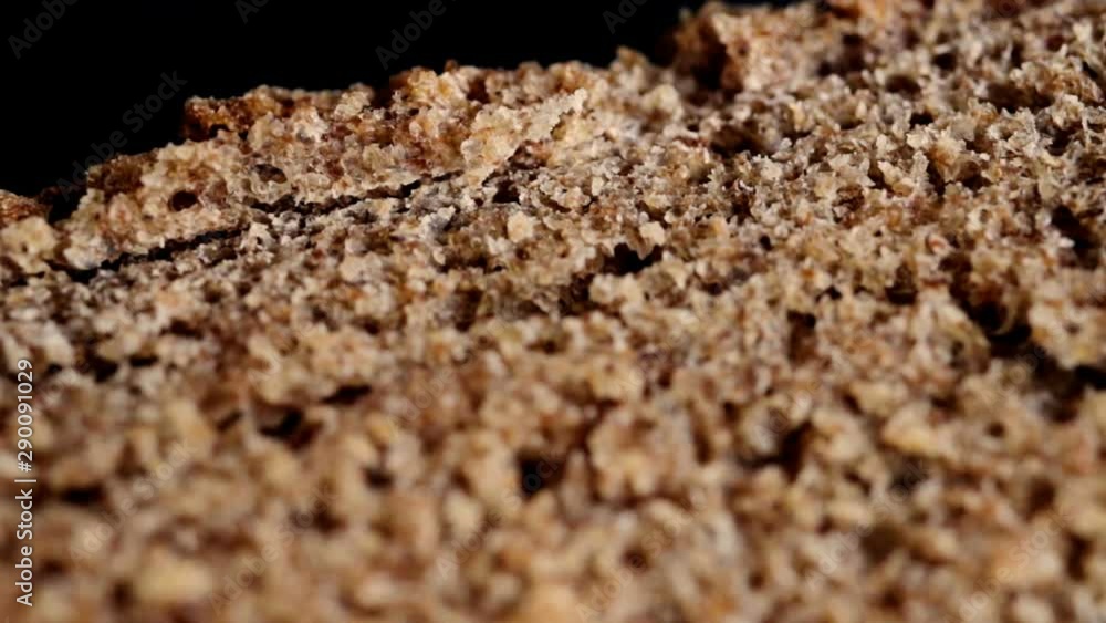 Black rye bread piece macro shot. Details, texture. Selective focus. Healthy natural eating concept. Black rye bread piece macro shot. Details, texture. Selective focus. Healthy natural eating concept.