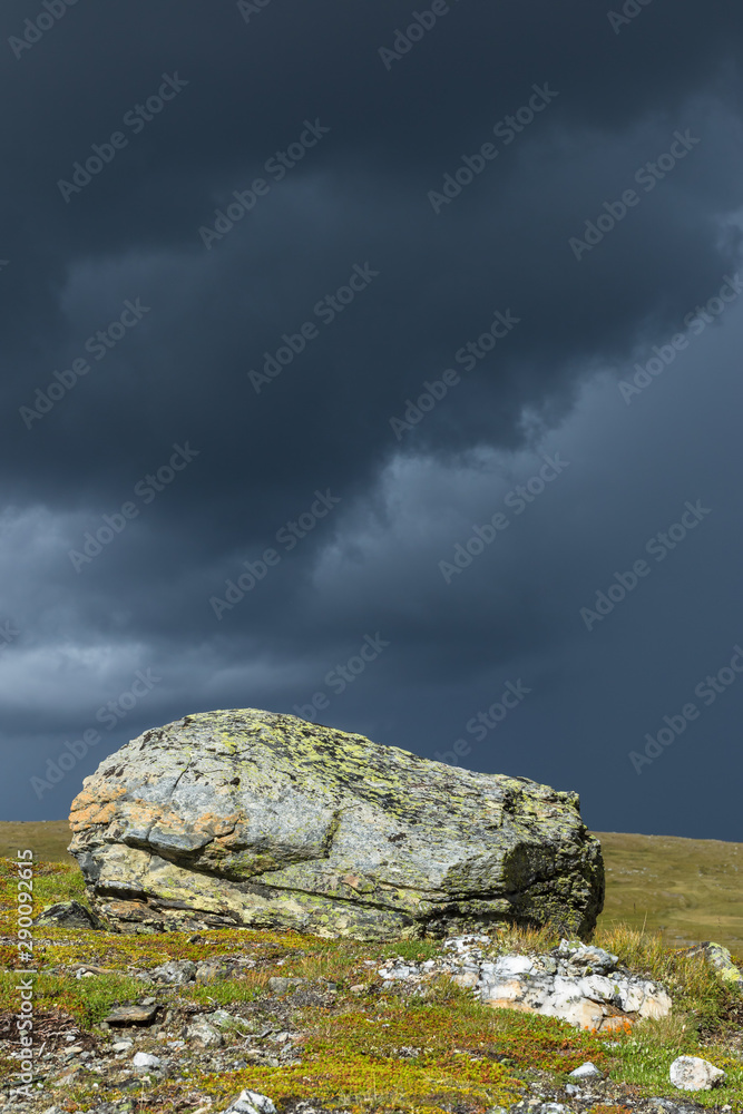 Rocks with dark thunderstorm clouds in the sky Rocks with dark thunderstorm clouds in the sky