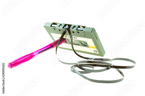 A pen pink and cassette tape compact retro at white background