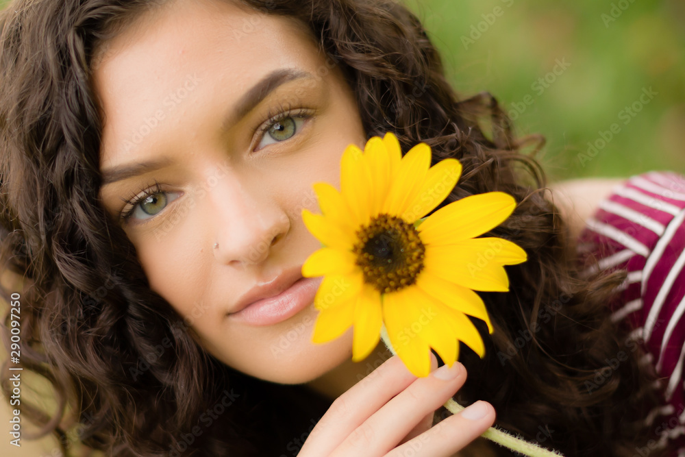 Brunetter high school senior girl with sunflower Brunetter high school senior girl with sunflower