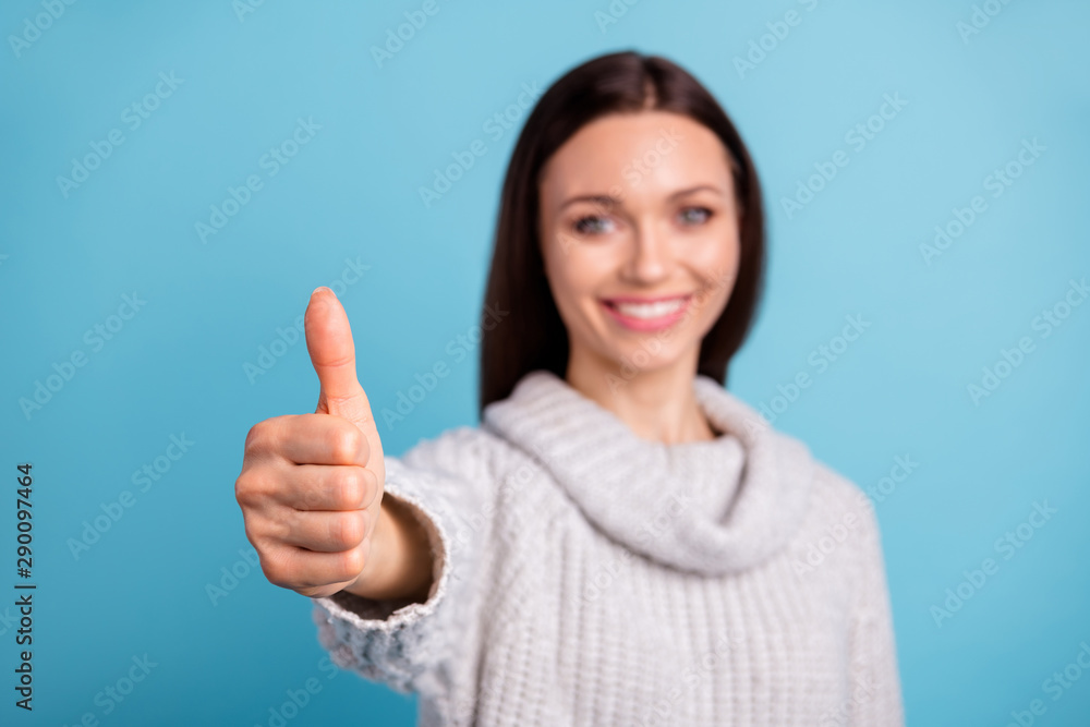 Portrait of positive girl promoter select adverts suggest promotion point thumbs-up advertise wear white jumper isolated over blue color background Portrait of positive girl promoter select adverts suggest promotion point thumbs-up advertise wear white jumper isolated over blue color background