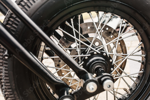 Classic motorcycle front wheel with chrome spoke and disc brake with classic tire