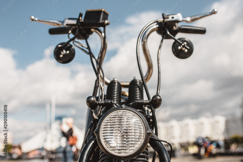 U shape steering wheel of chopper motorcycle against blue sky