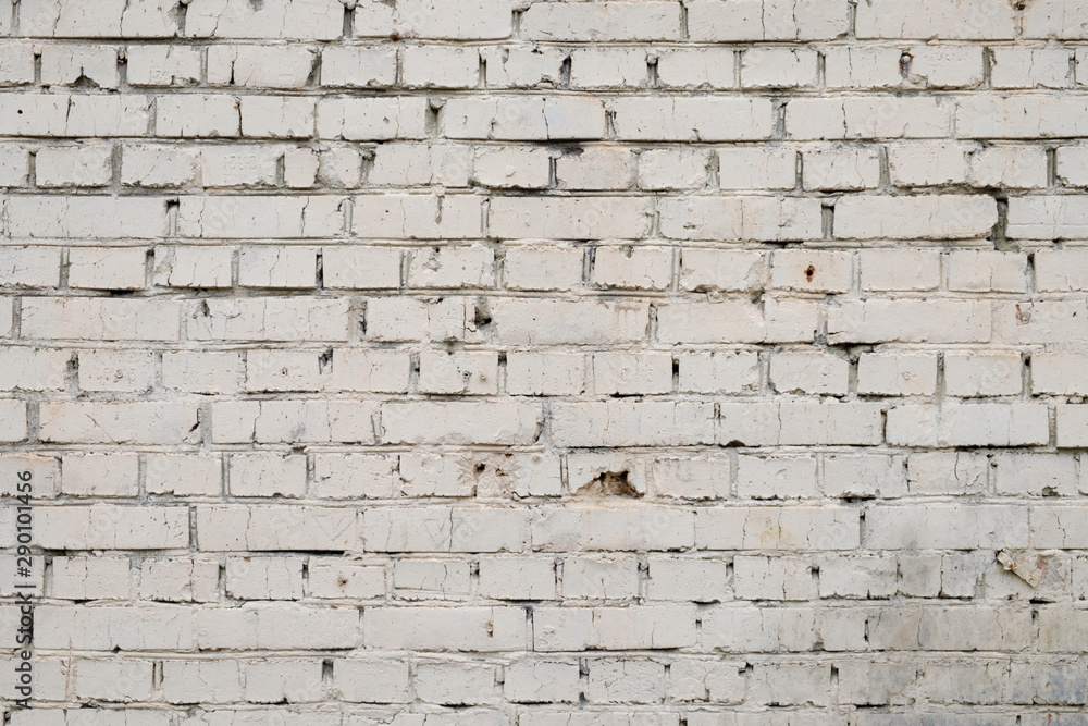 Wall of brick painted with light beige paint, texture Wall of brick painted with light beige paint, texture