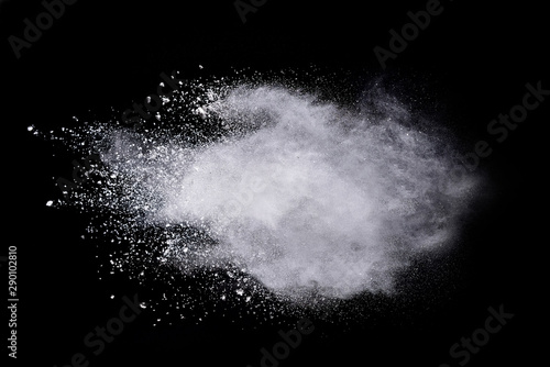 Fototapeta Naklejka Na Ścianę i Meble -  Freeze motion of white color powder exploding on dark background. 