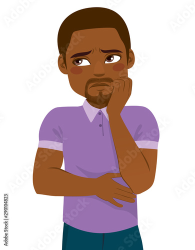 Young black man with hand on face making concerned expression
