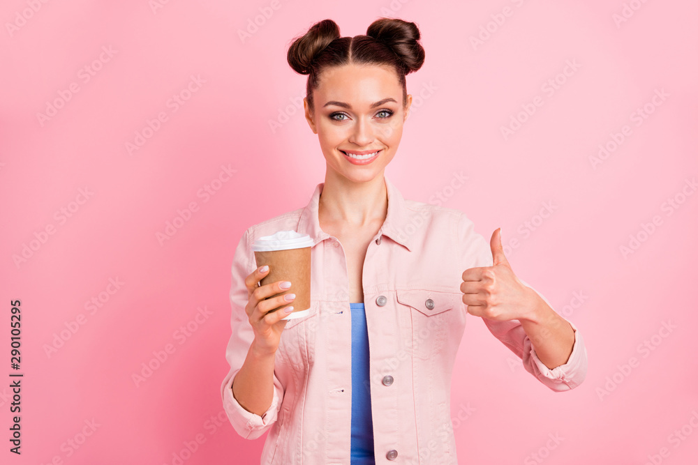 Portrait of cheerful woman showing her thumb up wearing jacket isolated over pink background Portrait of cheerful woman showing her thumb up wearing jacket isolated over pink background