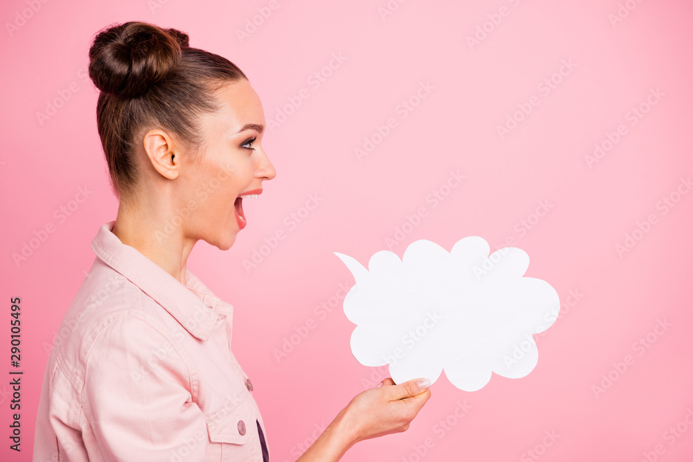 Profile side photo of crazy lady holding paper card bubble shouting news wearing jacket isolated over pink background Profile side photo of crazy lady holding paper card bubble shouting news wearing jacket isolated over pink background