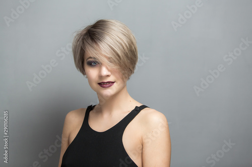  Portrait of young beautiful blonde woman with short hair 
