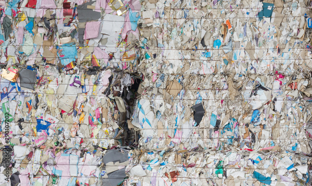 Naklejka premium Paper pulp compressed background and texture. waste paper waiting fro recycle in factory.