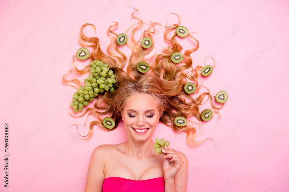 Close up top above high angle view photo beautiful she her lady paradise lying down full kiwi grape fruits long curls healthy lifestyle procedure service tasty napping isolated pink background