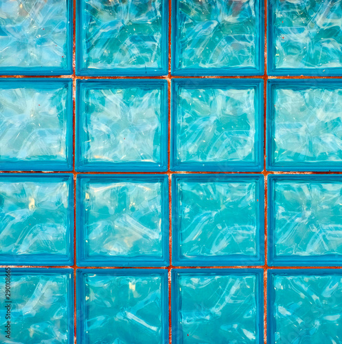 Square panel of blue glass blocks, graphic element for backdrops and backgrounds.