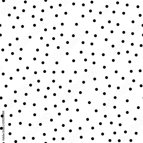 Random scattered polka dots, abstract black and white background.