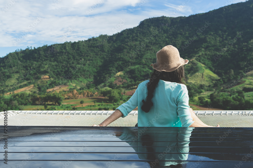 woman sitting on the terrace for looking mountain and nature view