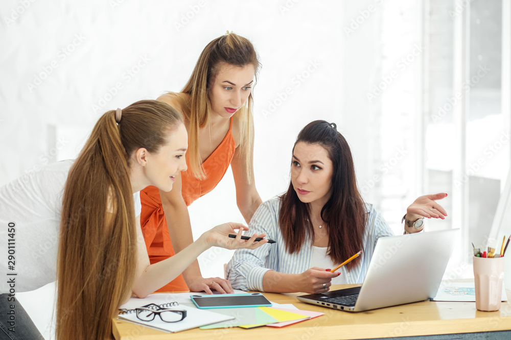 A team of creative people discusses a work project in the office. Brainstorm. The concept of work, colleagues and work on the result. A team of creative people discusses a work project in the office. Brainstorm. The concept of work, colleagues and work on the result.
