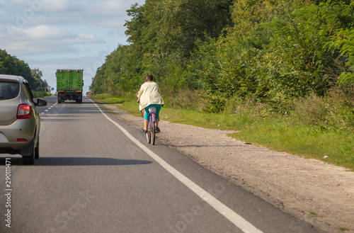 Cyclist rides on the highway on a bicycle