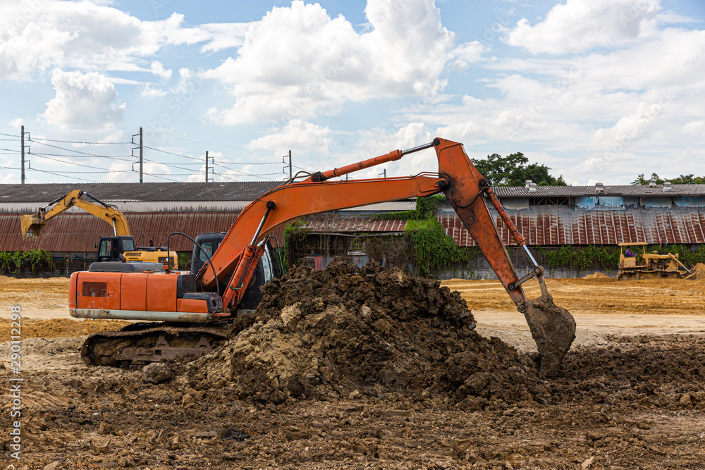 excavator and empty truck working at the construction site excavator and empty truck working at the construction site