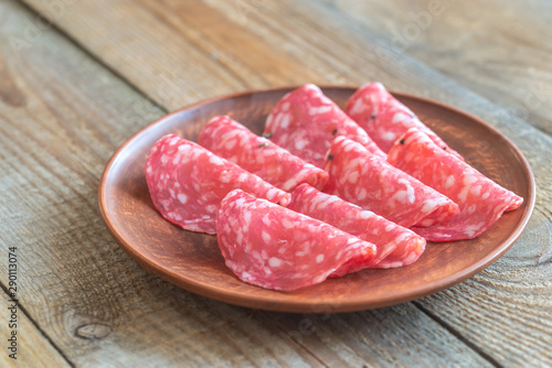 Slices of salami on the plate