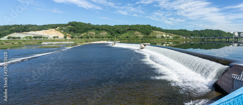 Panorama view of the uniquely weir across Nakdong River near Andong. The wier has a mask shaped water gate that is an symbolic of Andong. photo