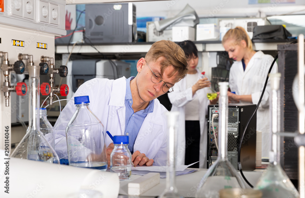 Fototapeta premium Male scientist working at biochemical laboratory