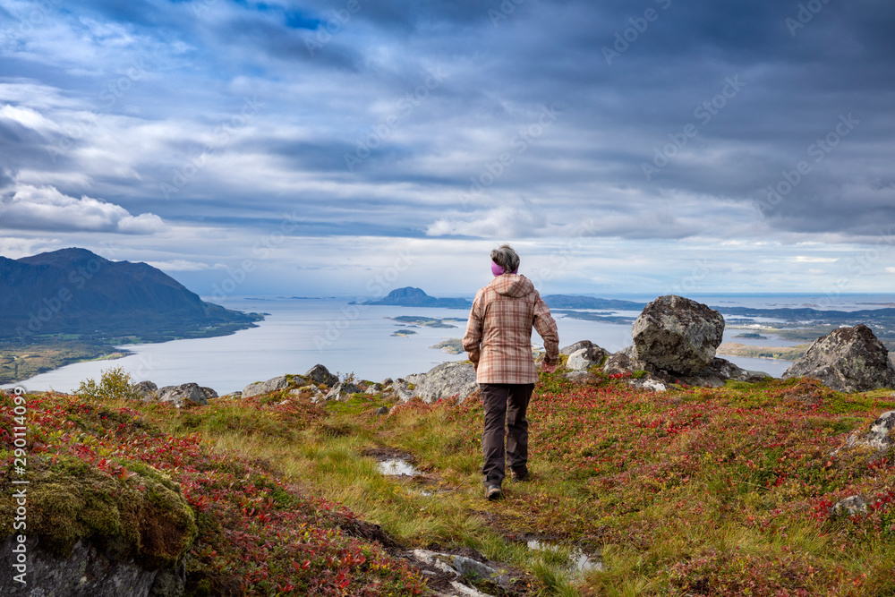 Woman on the mountain Gurumanen in Northern Norway Woman on the mountain Gurumanen in Northern Norway
