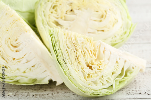 Ripe cabbage on white wooden table