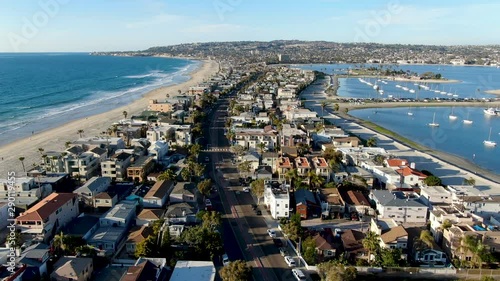 Aerial view of Mission Bay & Beaches in San Diego, California. USA. Community built on a sandbar with villas, sea port.  & recreational Mission Bay Park. Californian beach-lifestyle.