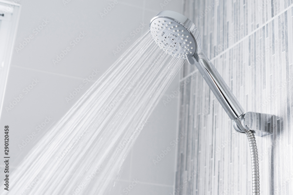 Bathroom shower head spraying water  - obrazy, fototapety, plakaty 