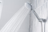 Bathroom shower head spraying water 