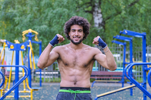 Fotografie Boxer trains on a street sports ground