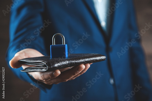 man hand holding lock in money on wallet