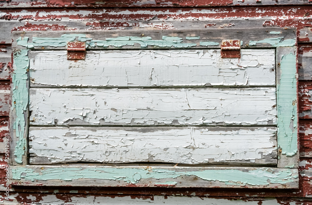 Closeup of old wooden horizontal window with closed hinged shutter, Closeup of old wooden horizontal window with closed hinged shutter,