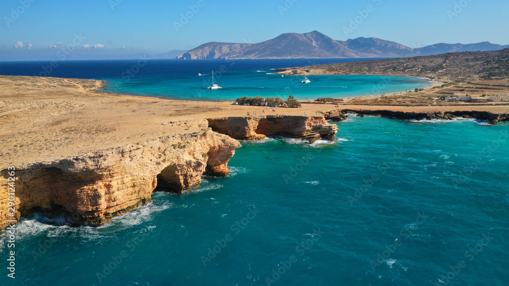 Aerial drone photo of iconic caves of Xylobatis or Ksylompatis in Koufonisi island, Small Cyclades, Greece Aerial drone photo of iconic caves of Xylobatis or Ksylompatis in Koufonisi island, Small Cyclades, Greece