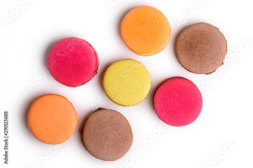 Set of colorful macarons on isolated white background. Top view