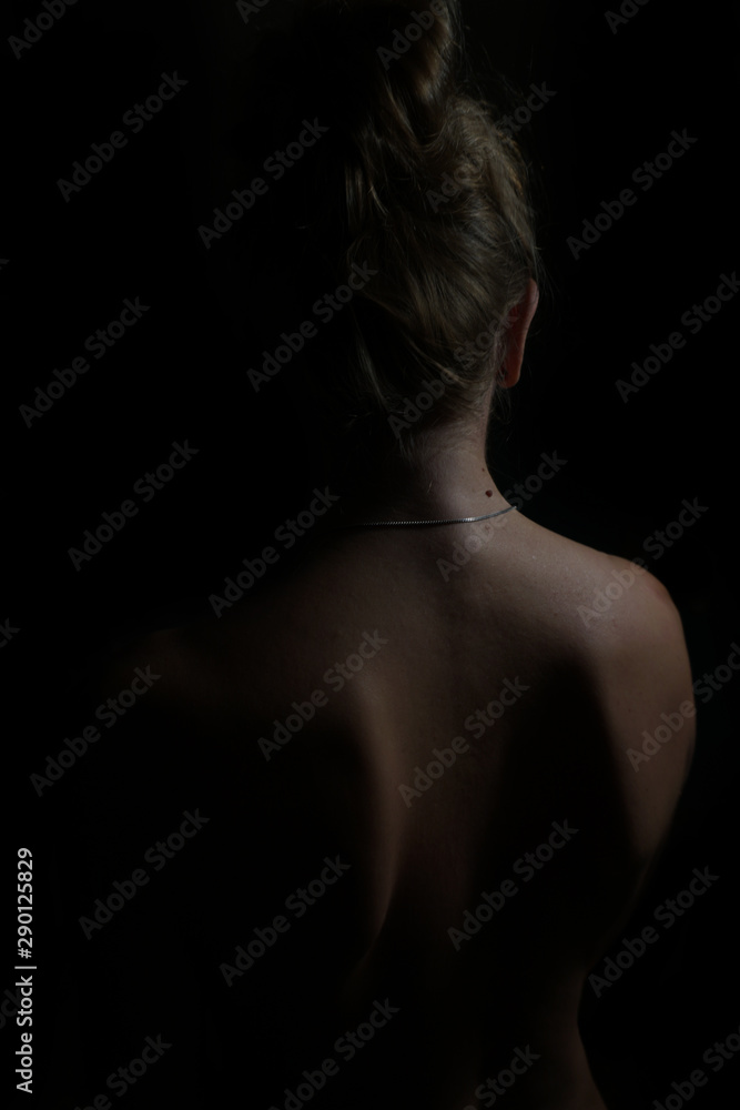 Female body silhouette. Woman body lines on a dark background Female body silhouette. Woman body lines on a dark background