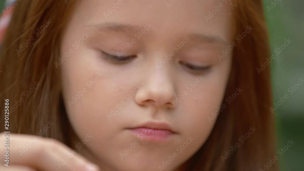 close up view of adorable child blowing soap bubbles close up view of adorable child blowing soap bubbles