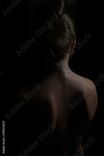 Female body silhouette. Woman body lines on a dark background