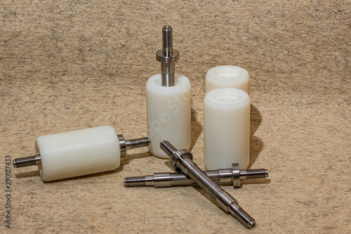 Cylindrical rollers made of polyacetal with steel shaft.