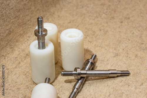 Cylindrical rollers made of polyacetal with steel shaft.