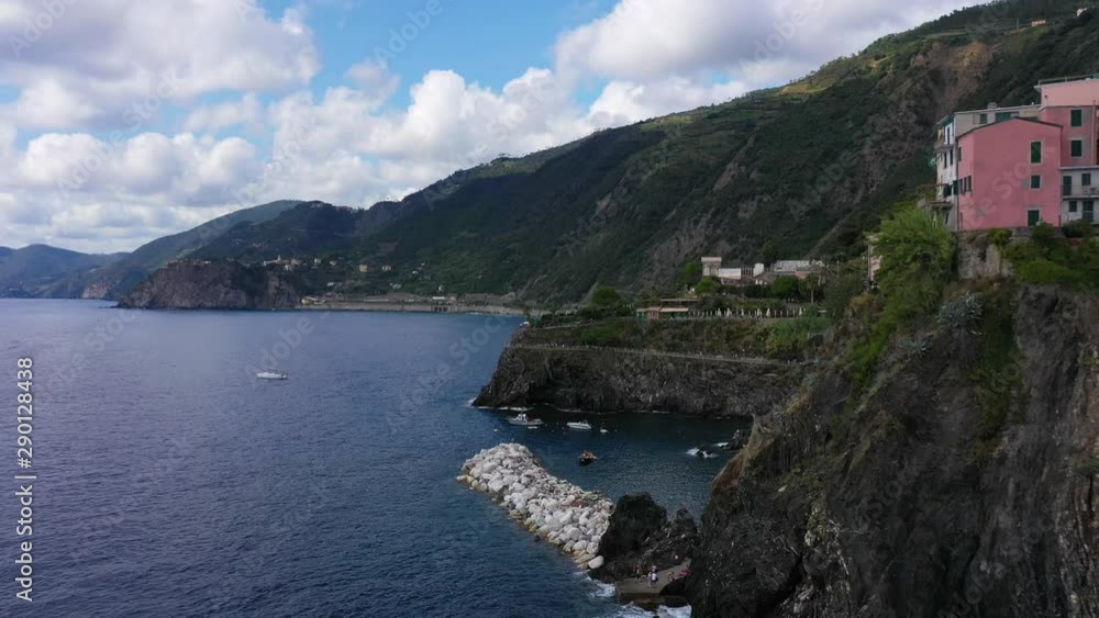 Panorama view of Manarola village one of Cinque Terre in La Spezia, Italy. Flight by a drone. Panorama view of Manarola village one of Cinque Terre in La Spezia, Italy. Flight by a drone.