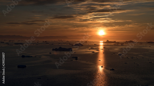 Sunbeam reflection on the Arctic Ocean in Greenland