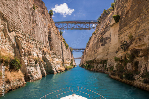 Passing through the Corinth Canal by yacht, Greece. The Corinth Canal connects the Gulf of Corinth with the Saronic Gulf in the Aegean Sea.