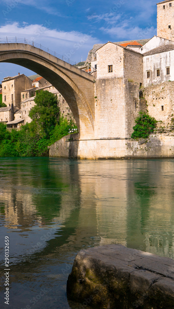 Stari Most bridge and its reflection in river Neretva - Old town of Mostar, Bosnia and Herzegovina