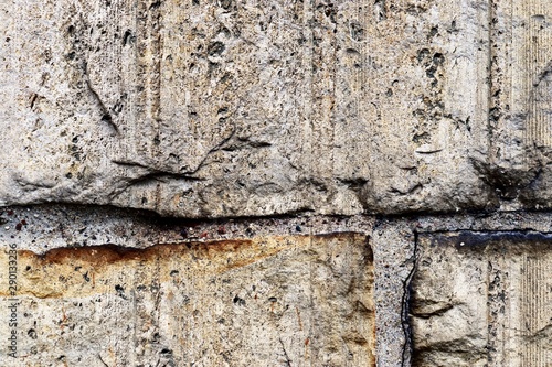 Aged and weathered conrete wall textures with cracks and lot of structure taken at old buildings photo