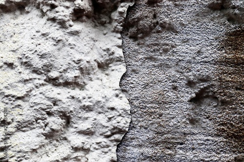 Aged and weathered conrete wall textures with cracks and lot of structure taken at old buildings photo