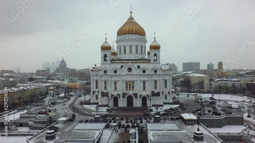 The Cathedral of Christ the Saviour against the winter urbanscape of Moscow. White moldings and golden domes look beautiful and majestic among typical civil architecture