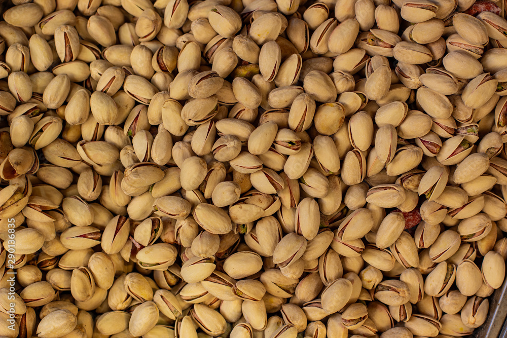 pistachios fried salted nuts textured background food picture in supermarket counter pistachios fried salted nuts textured background food picture in supermarket counter